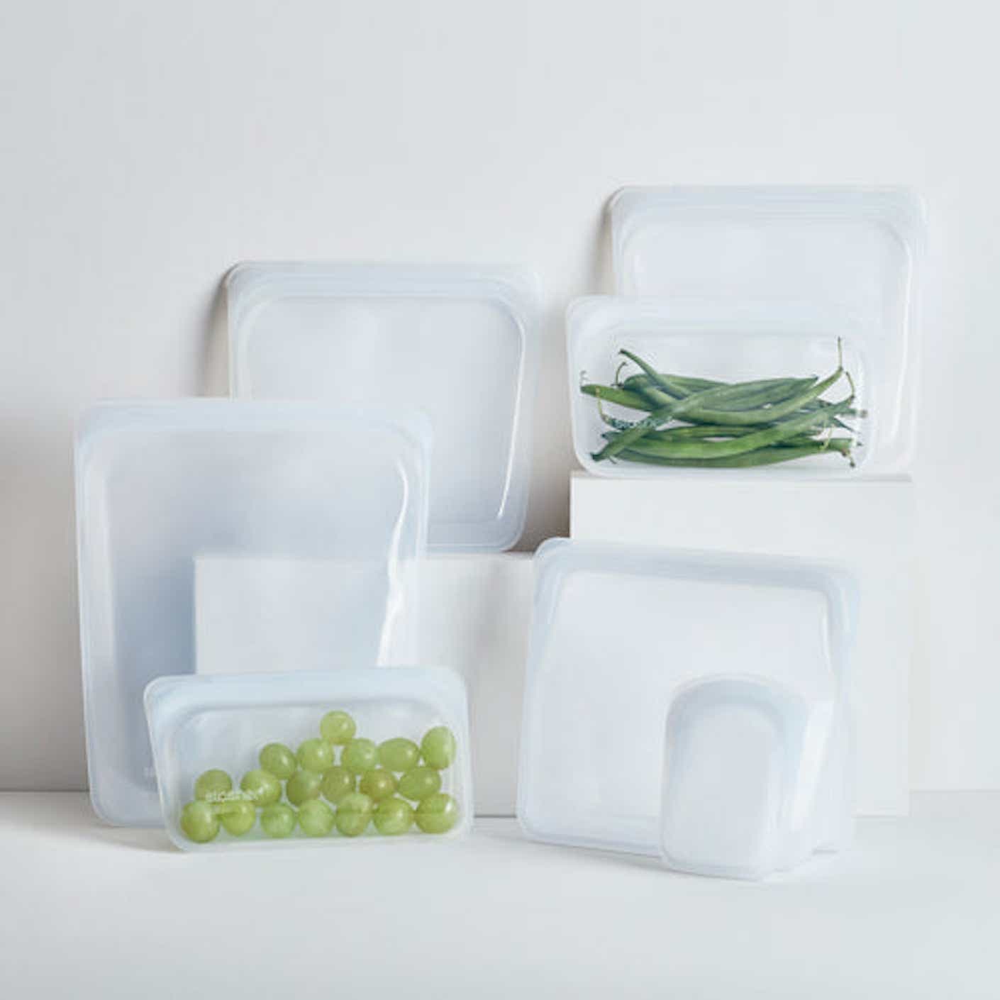 Clear food storage bags stacked against a white background.