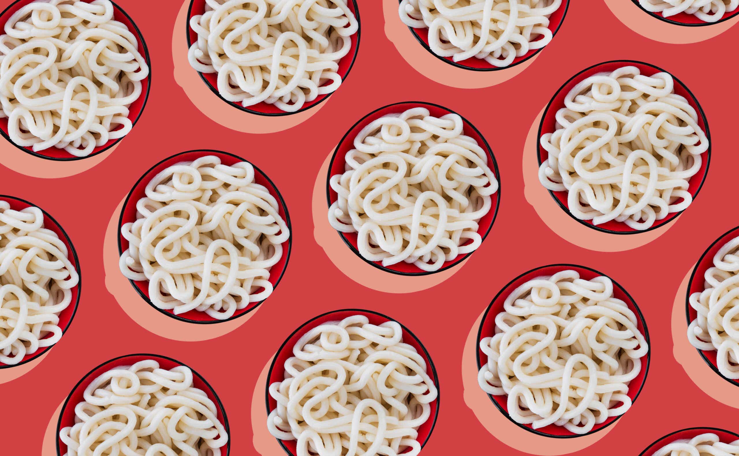 udon noodles on red background