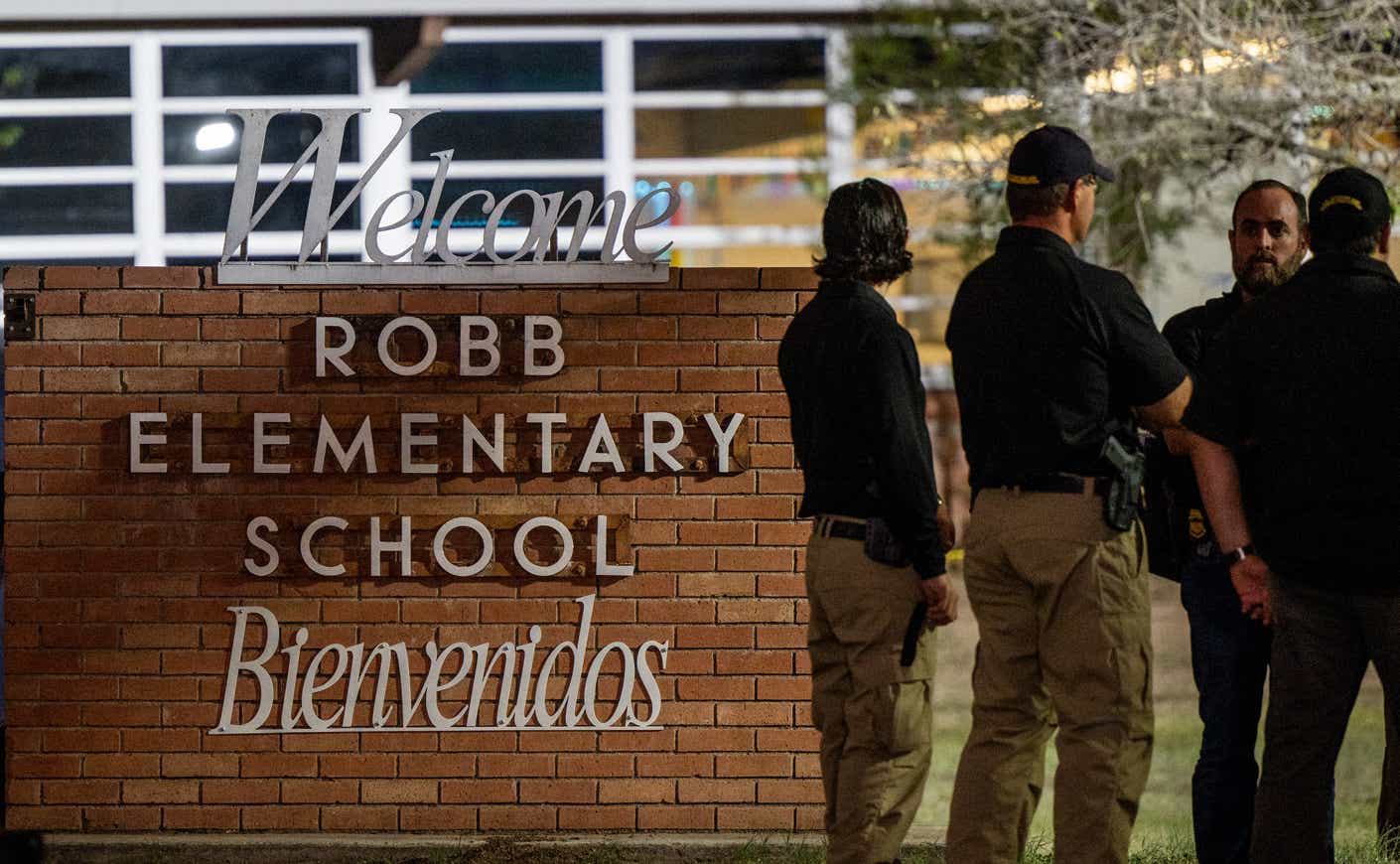 officers stand outside Robb Elementary School in Uvalde, Texas