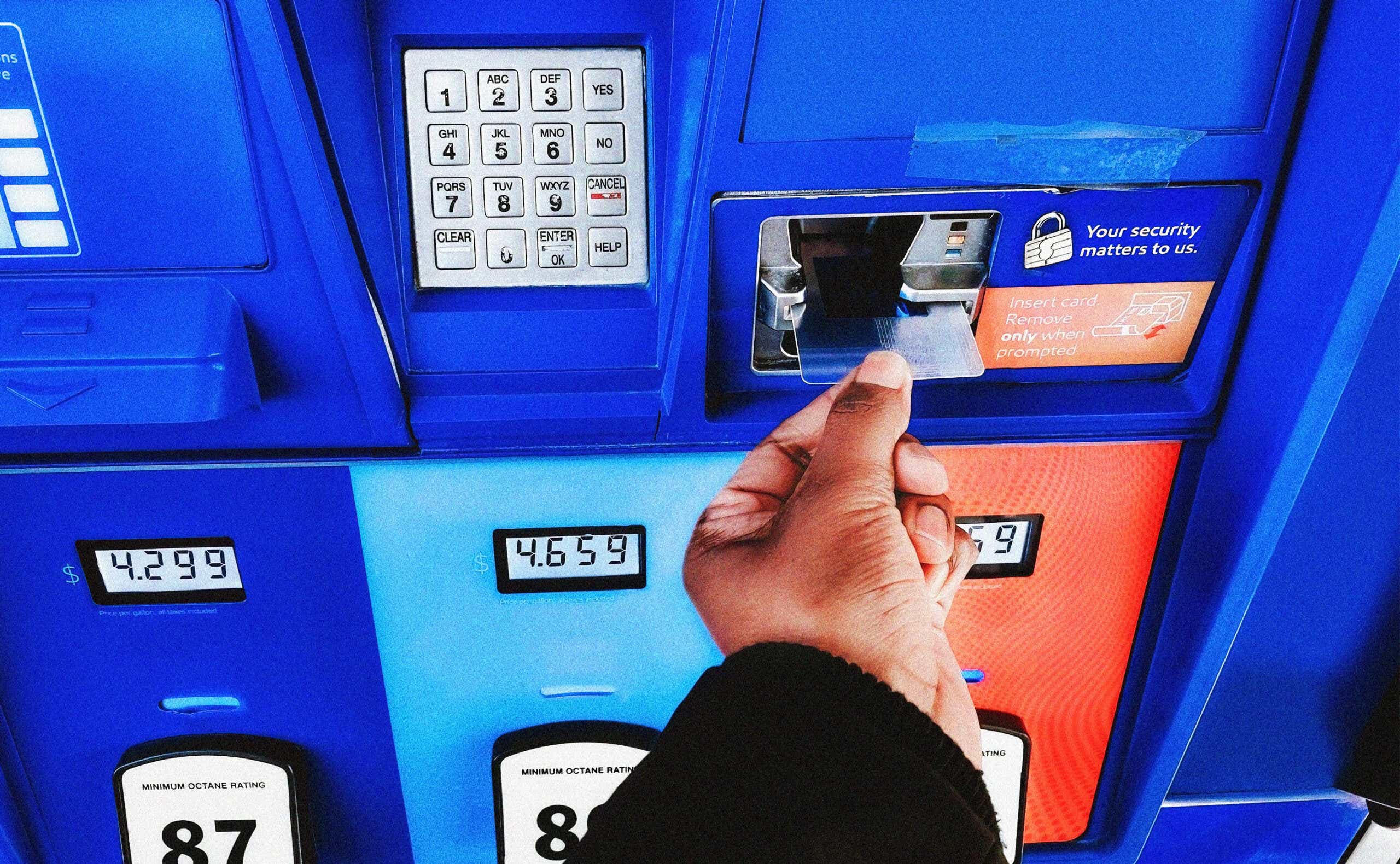 Black person using credit card to purchase gas priced at over $4 per gallon