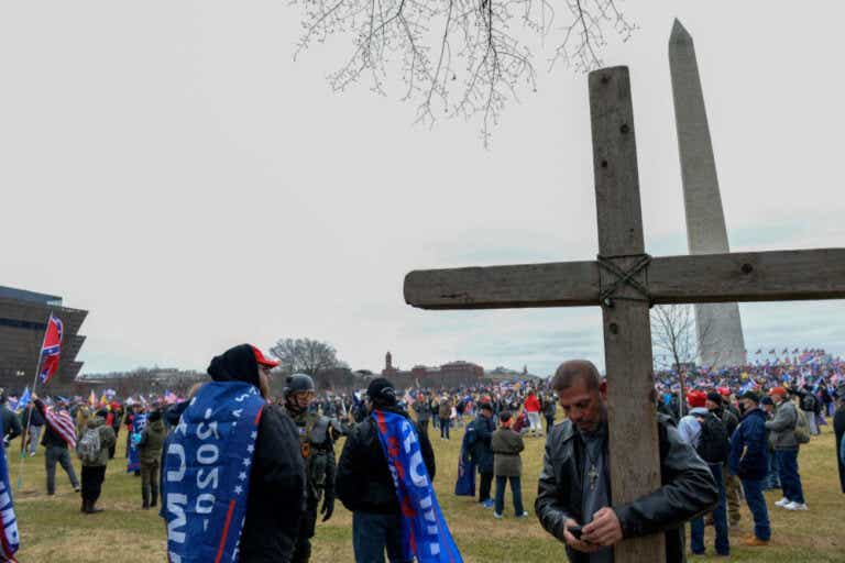 pro-Trump rioters with a large cross