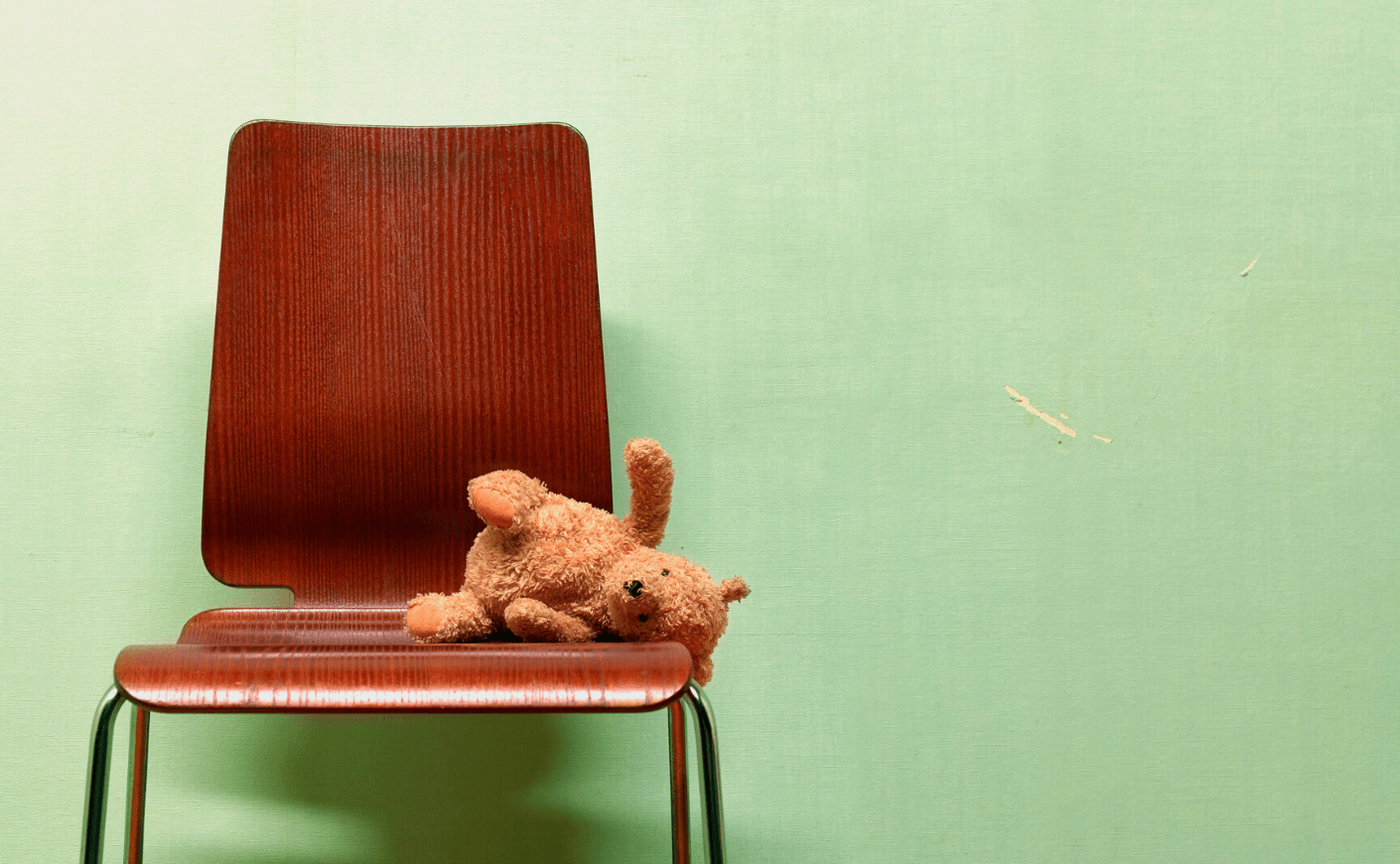 teddybear on chair alone