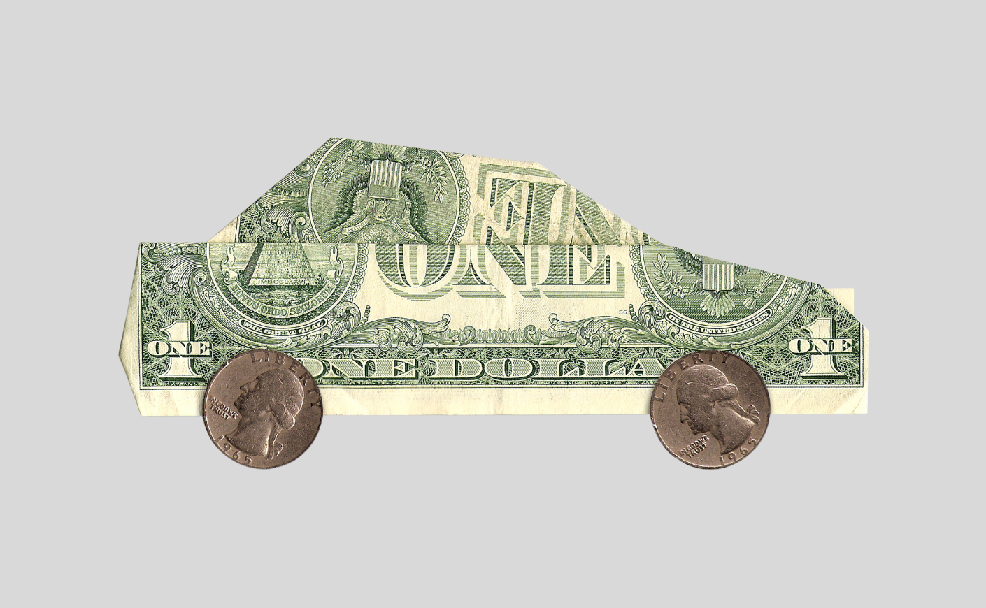 a car made of a folded dollar and coins