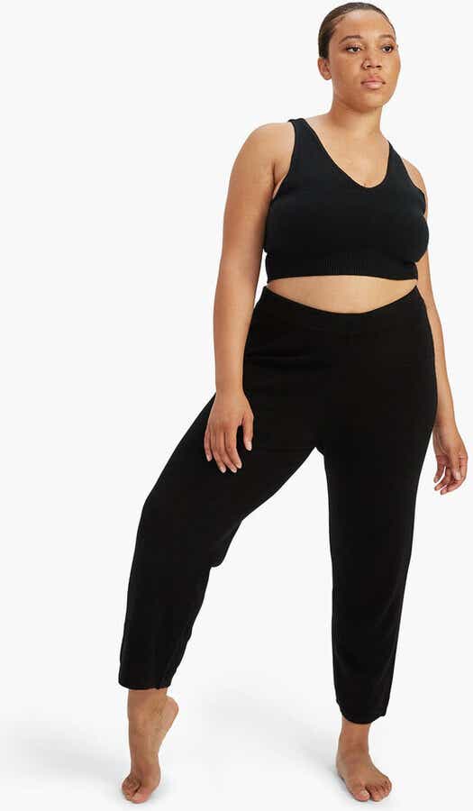 woman in crop top and matching black pants