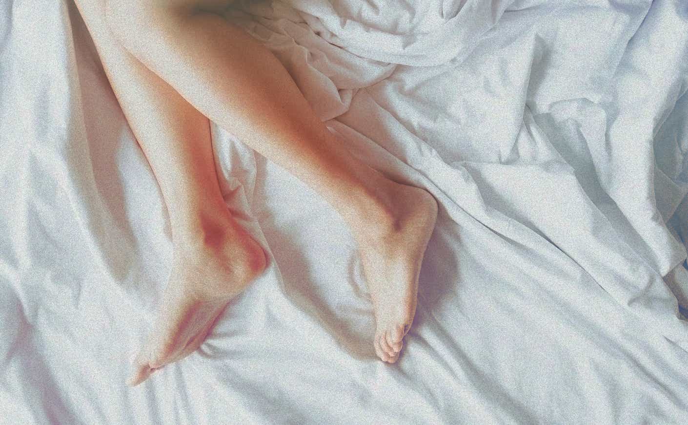 woman's legs in a bed