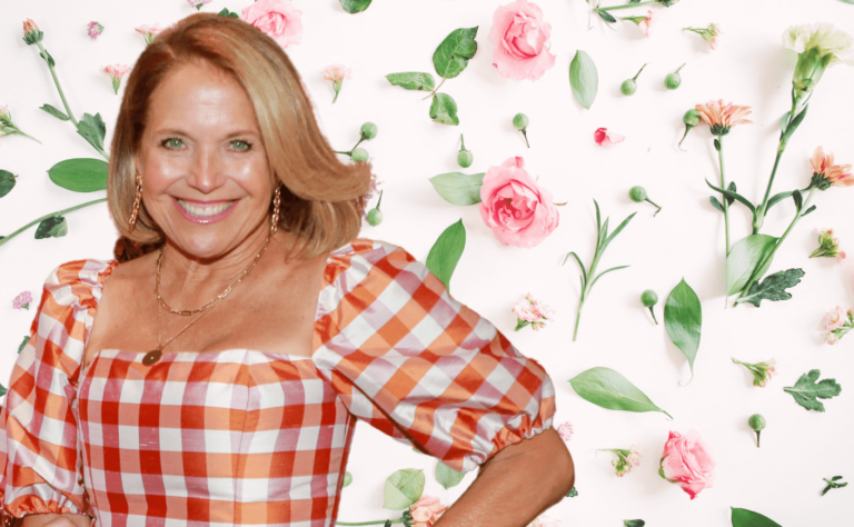 Katie Couric in front of florals