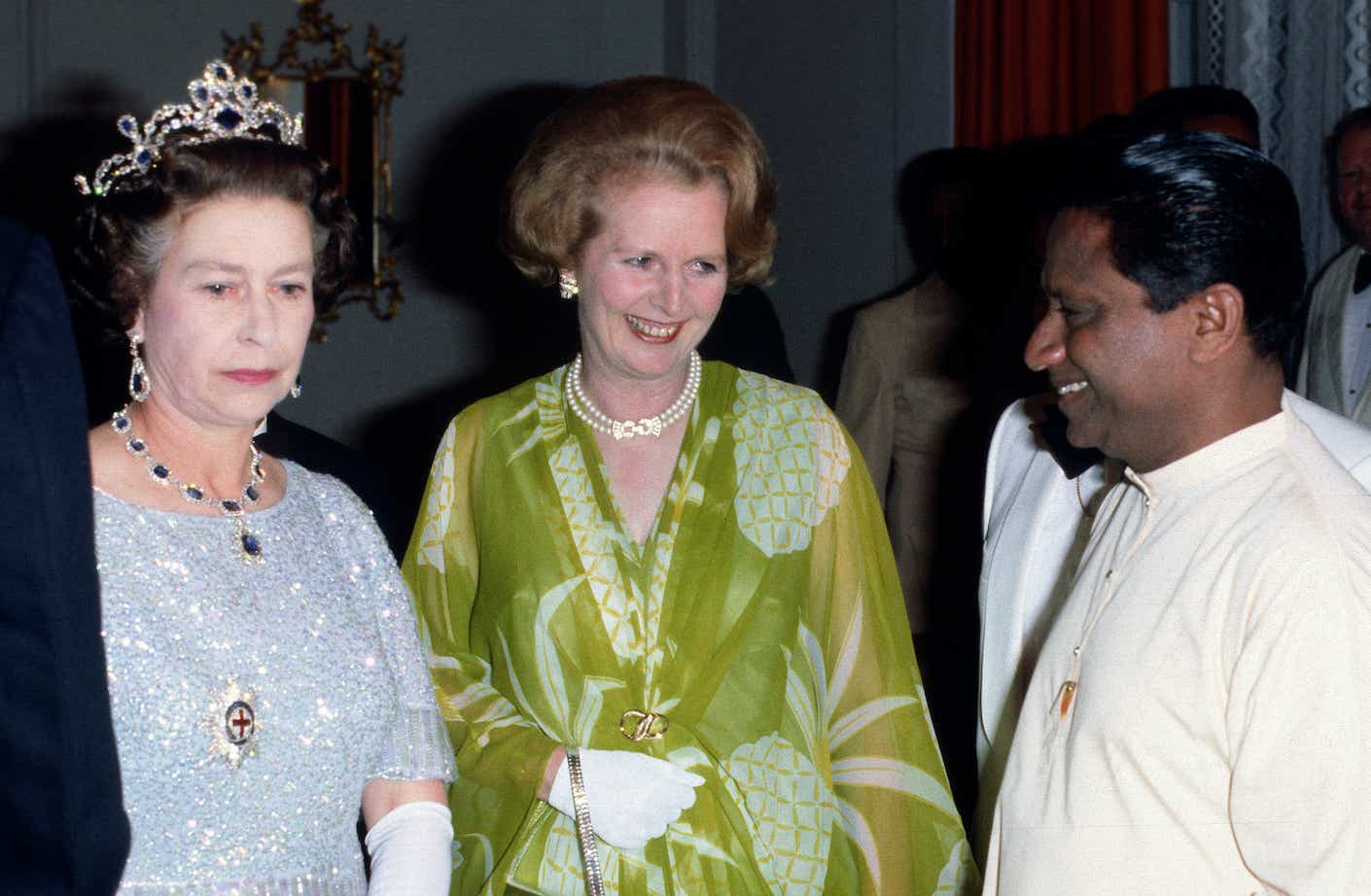 Queen Elizabeth II and Prime Minister Margaret Thatcher attend a ball to celebrate the Commonwealth Heads of Government Meeting hosted by President Kenneth Kaunda in 1979 in Lusaka, Zambia.