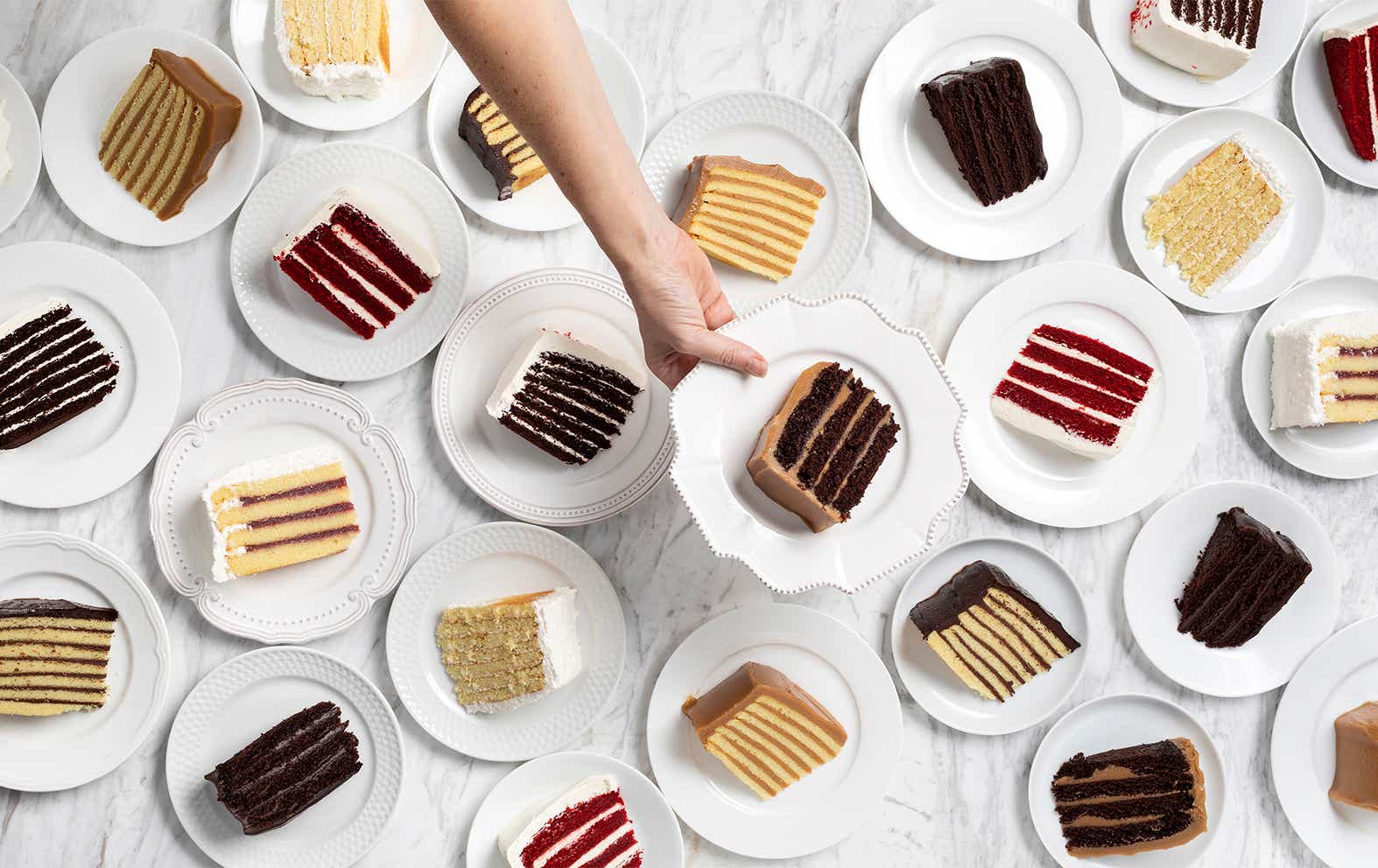 Slices of different cakes on plates