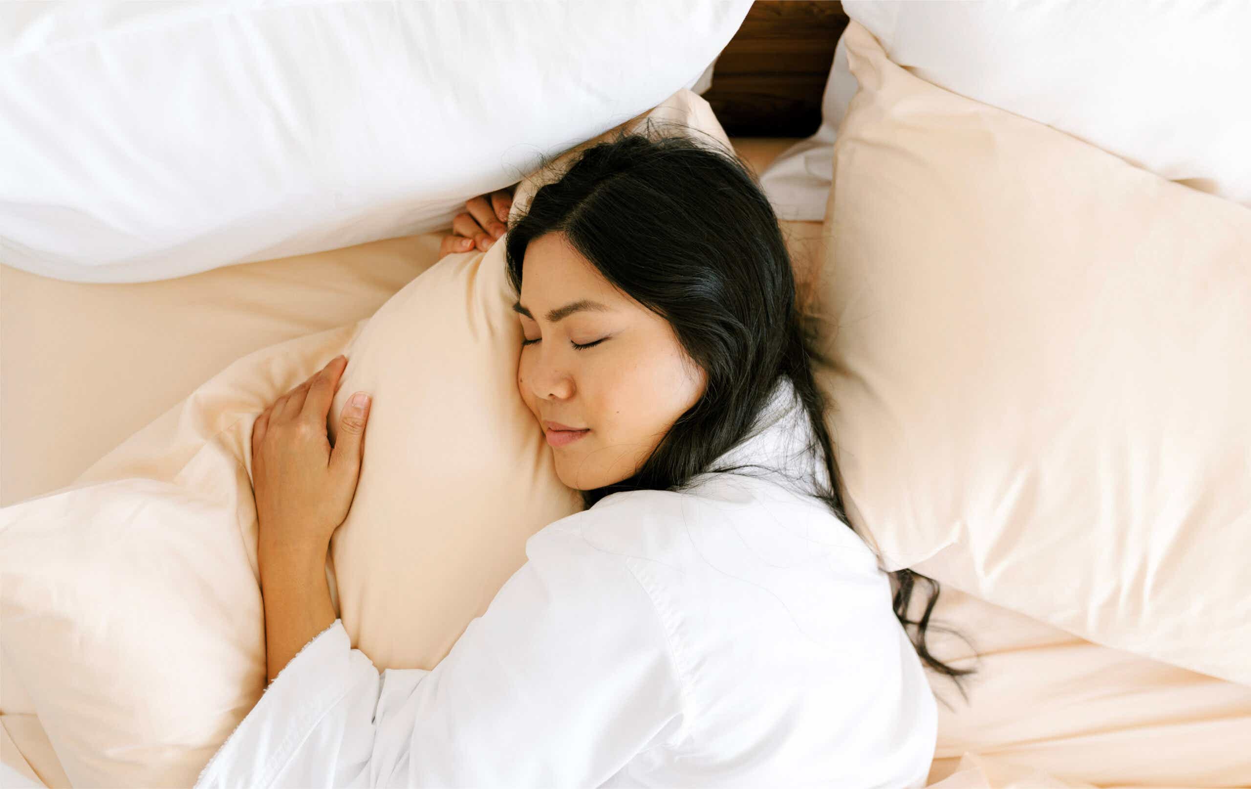 Woman sleeping on Jennifer Adams bedding