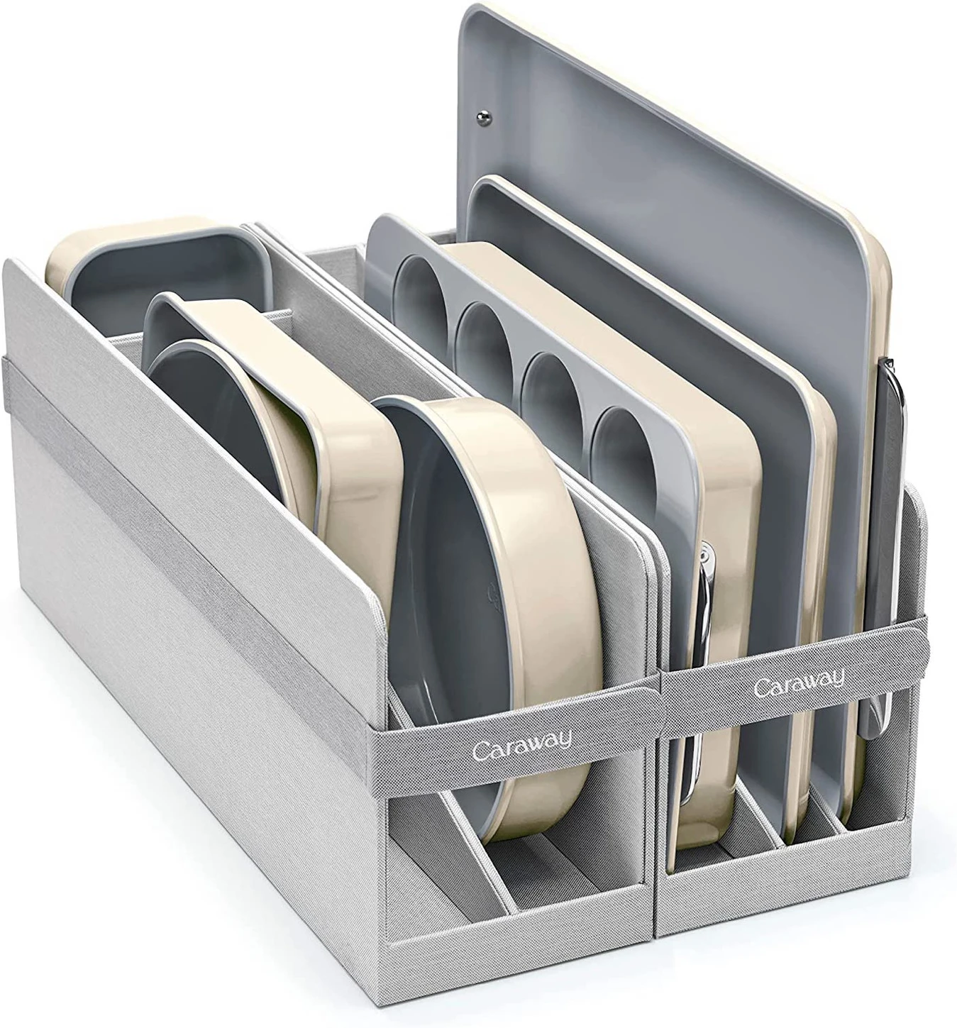 A set of metal bakeware is stacked on end in a metal rack.