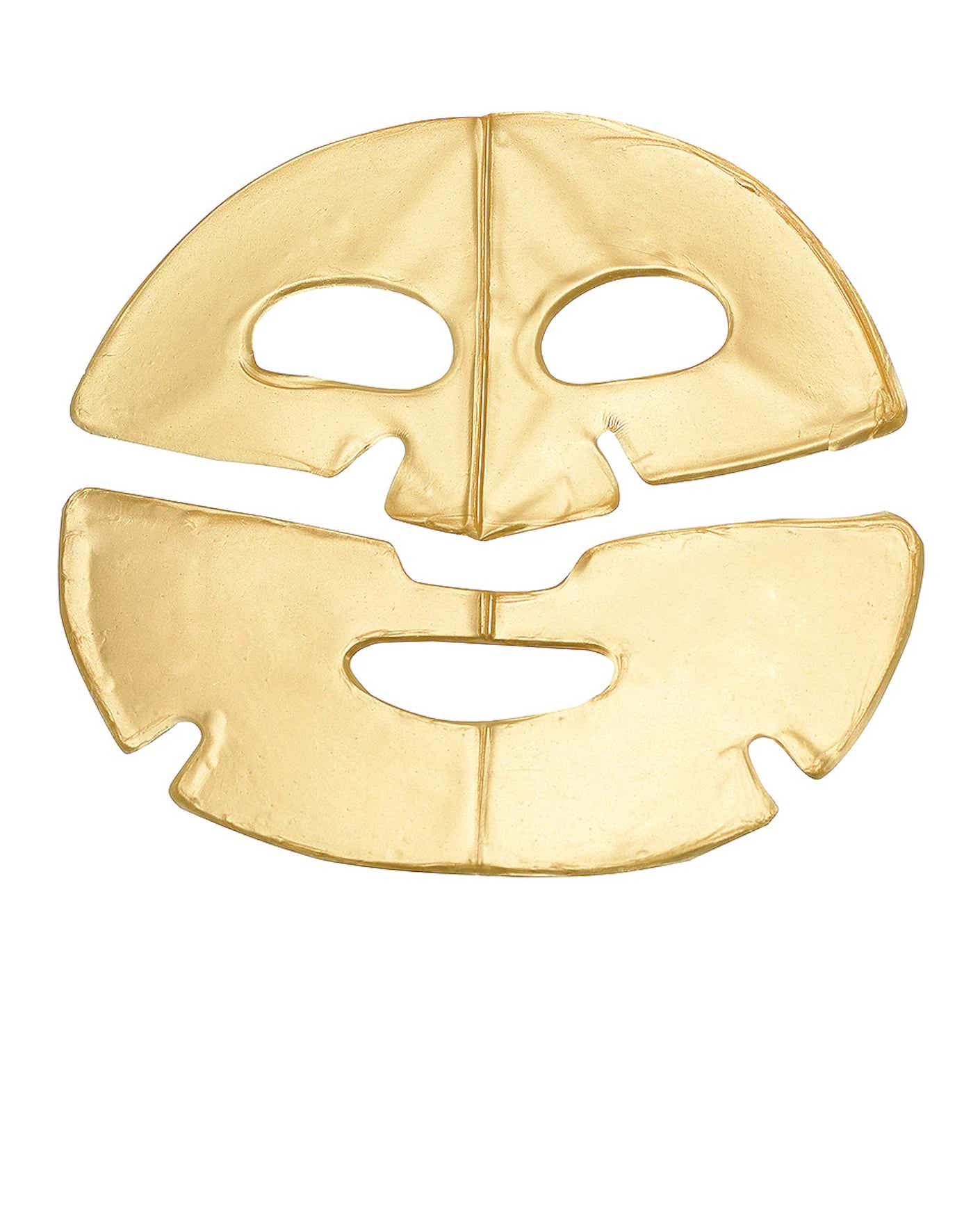 A gold foil mask lays flat.