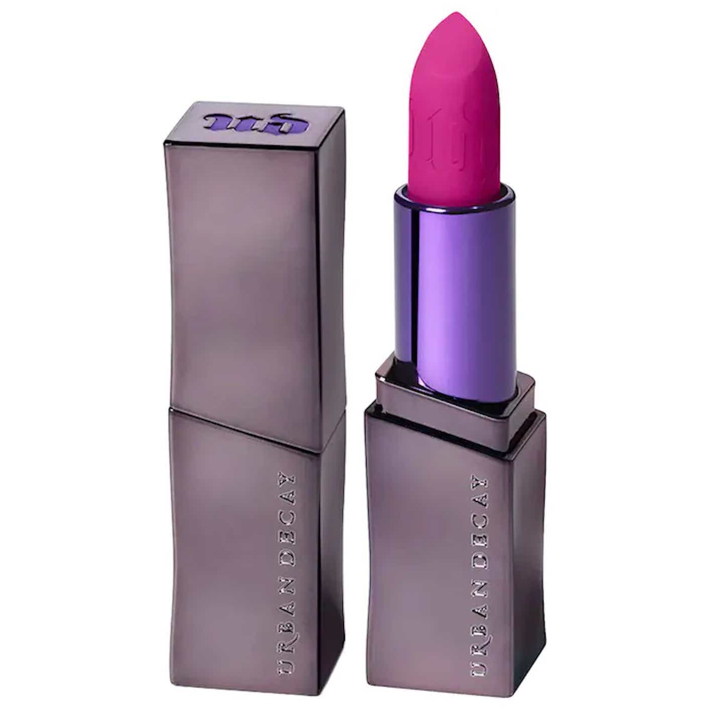 A metallic purple tube is full of hot pink lipstick.