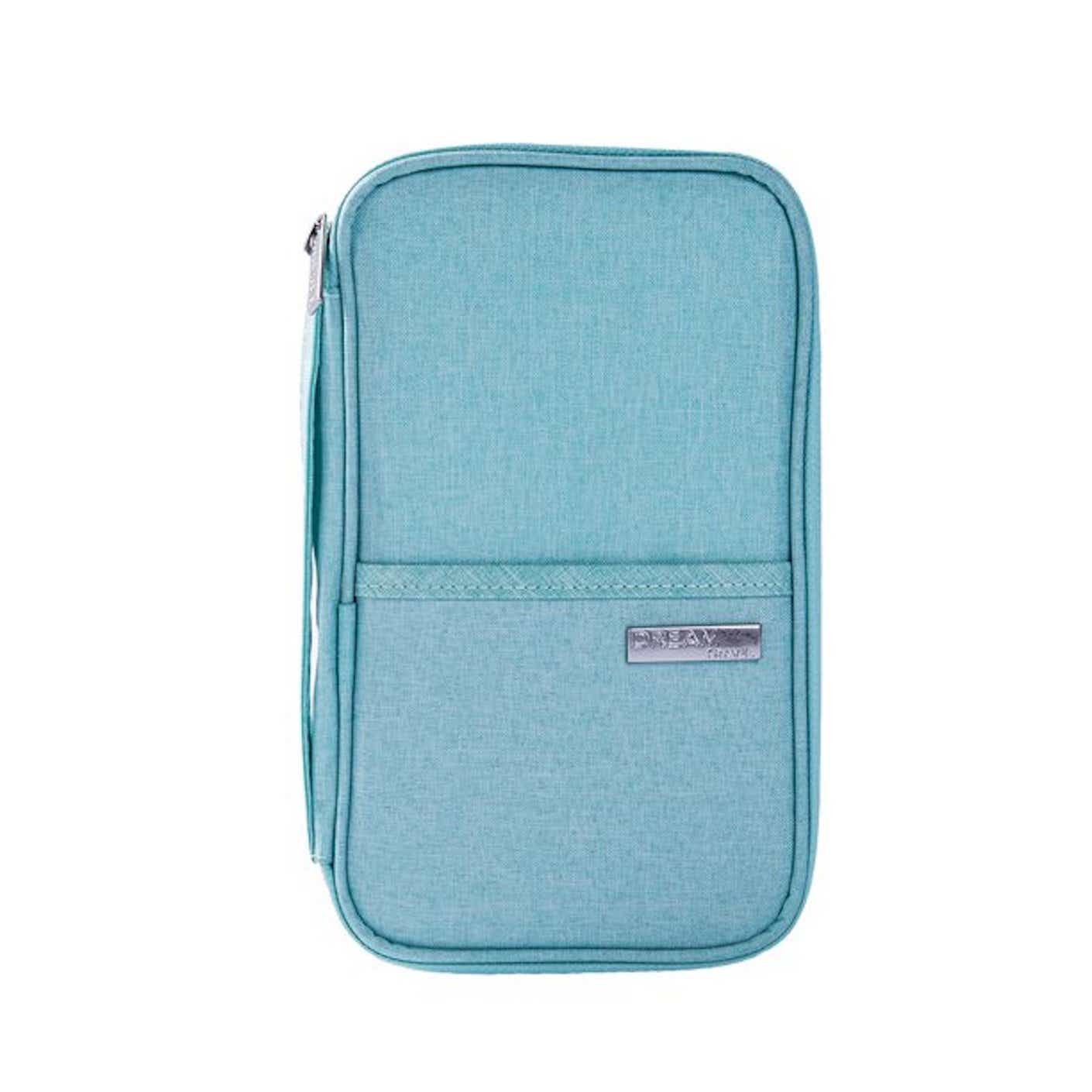 A soft, zippered, teal travel wallet lies flat on a white surface.