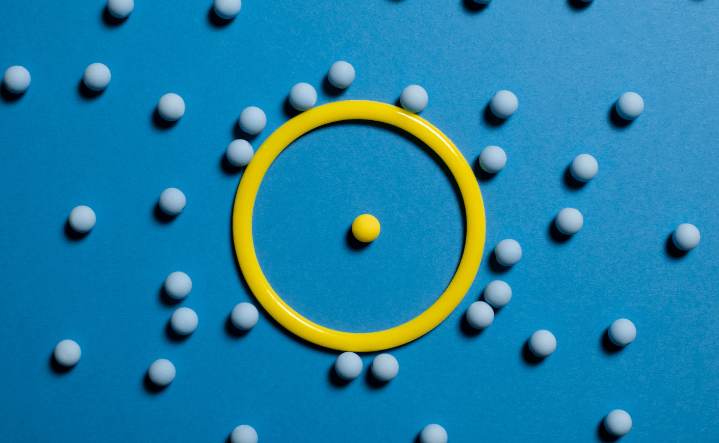 a yellow ball protected inside a ring