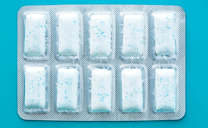 Push packet gum on blue background