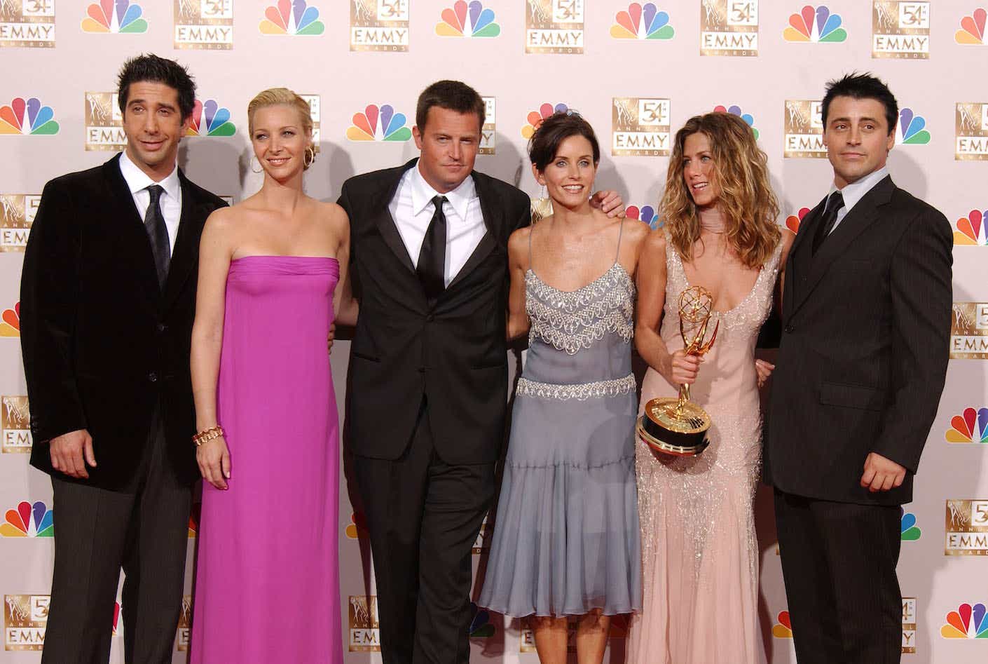 Actors David Schwimmer, Lisa Kudrow, Matthew Perry, Courteney Cox Arquette, Jennifer Aniston and Matt LeBlanc pose backstage during the 54th Annual Primetime Emmy Awards at the Shrine Auditorium on September 22, 2002 in Los Angeles, 
