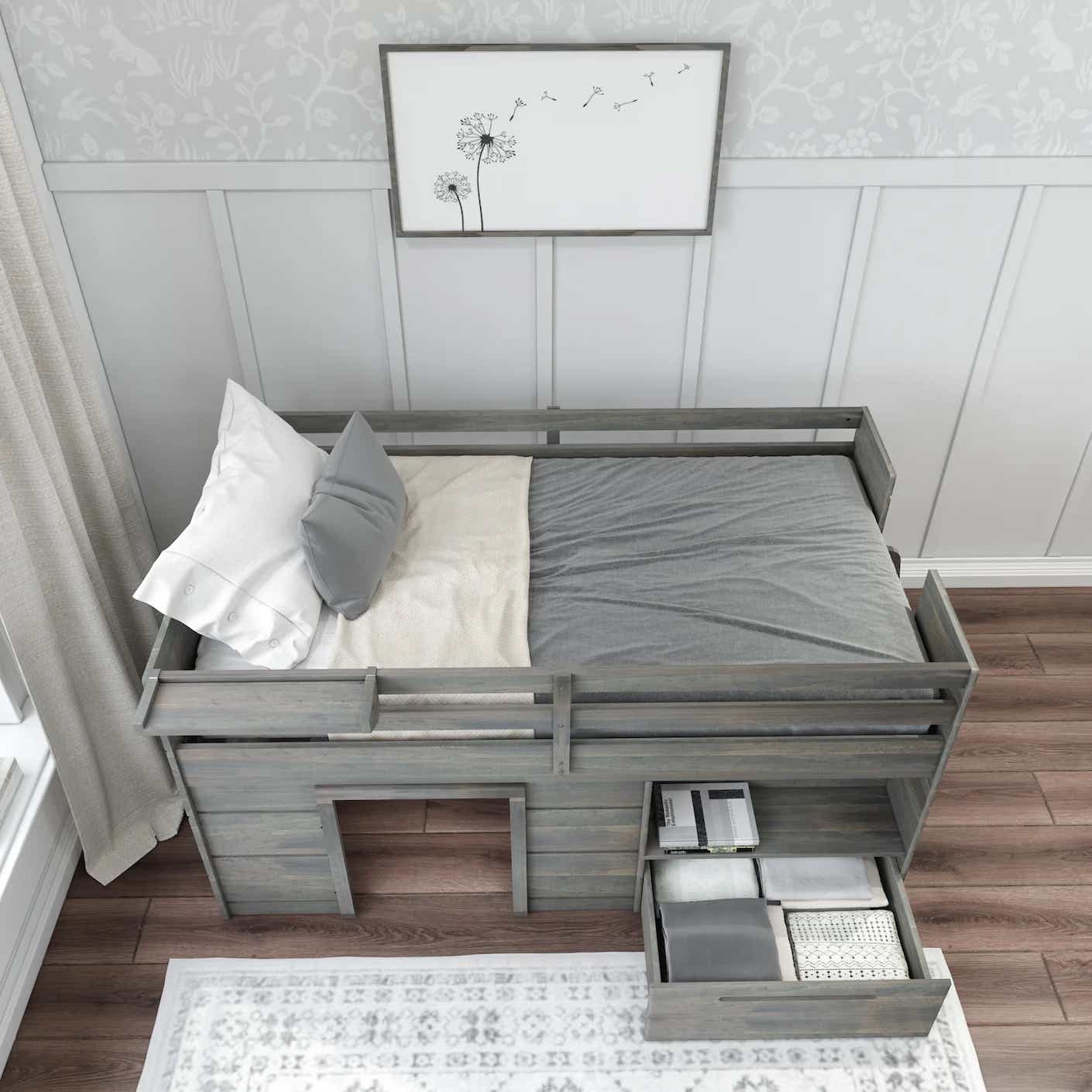An aerial shot of a grey wooden bunk bed with drawers and storage space under the loft portion.