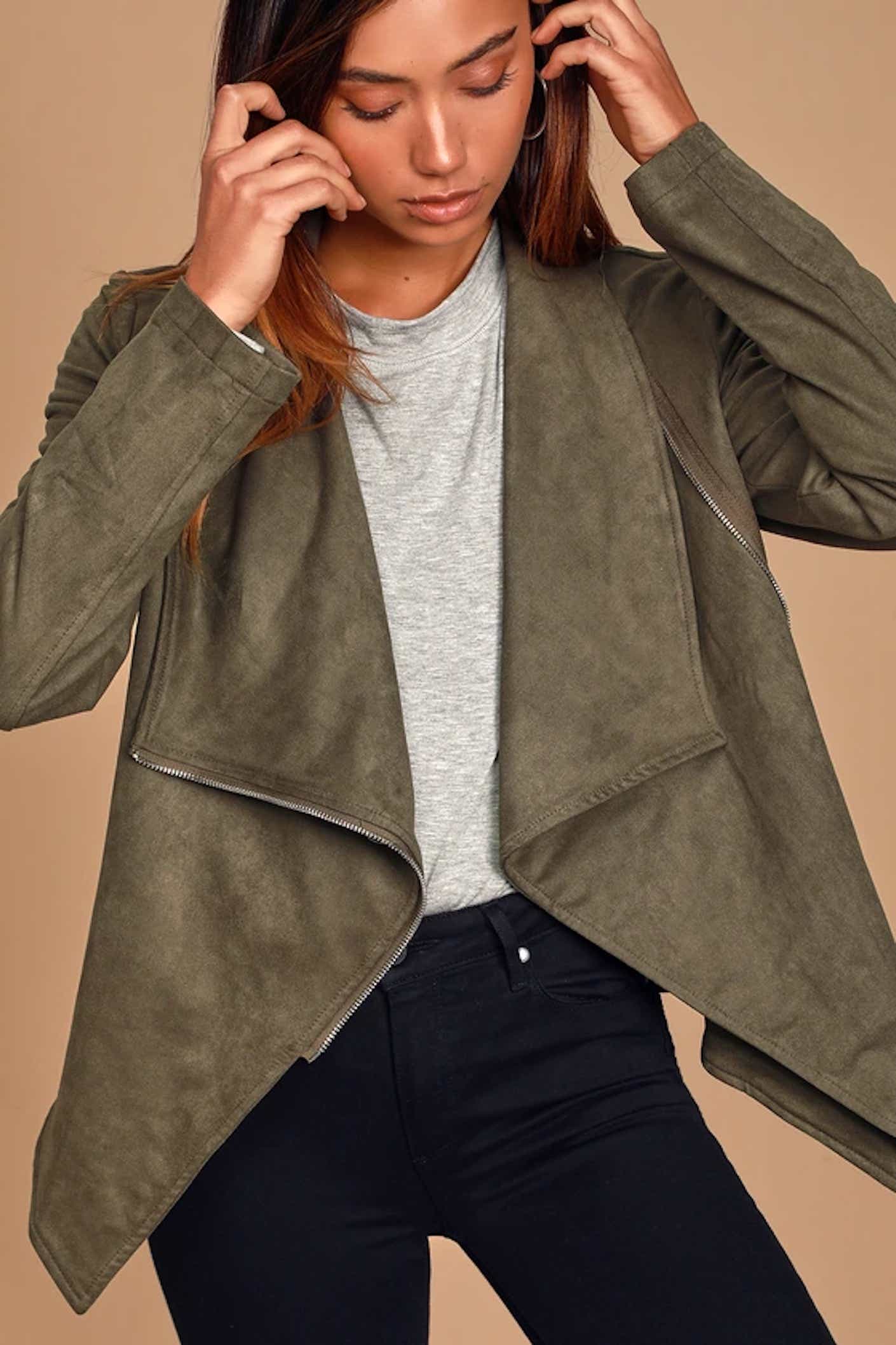 A woman wears a suede moto jacket with dramatic lapels.