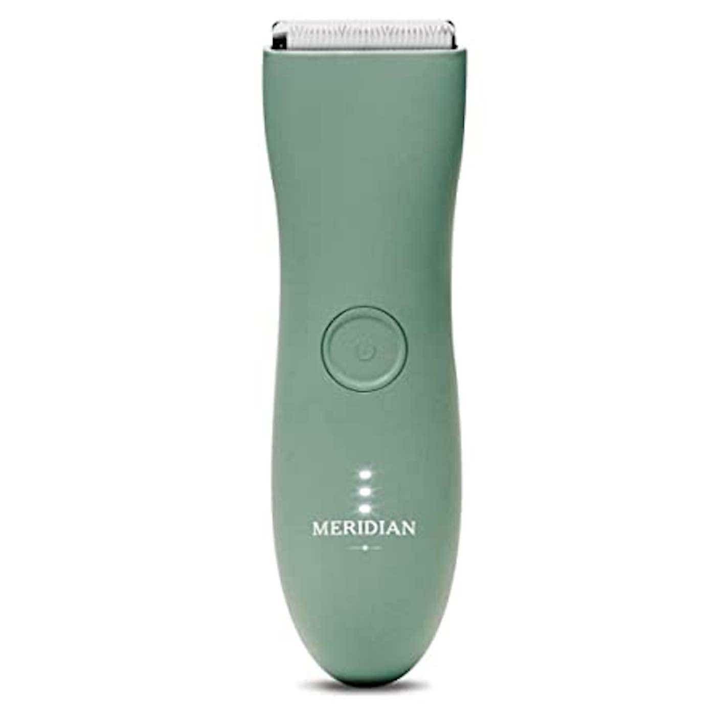 A sage green electric trimmer stands on end.