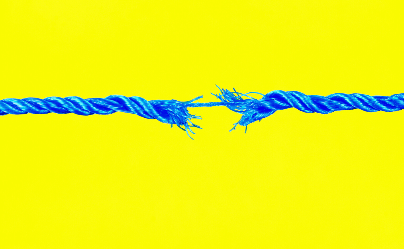 a rope pulled taught and fraying