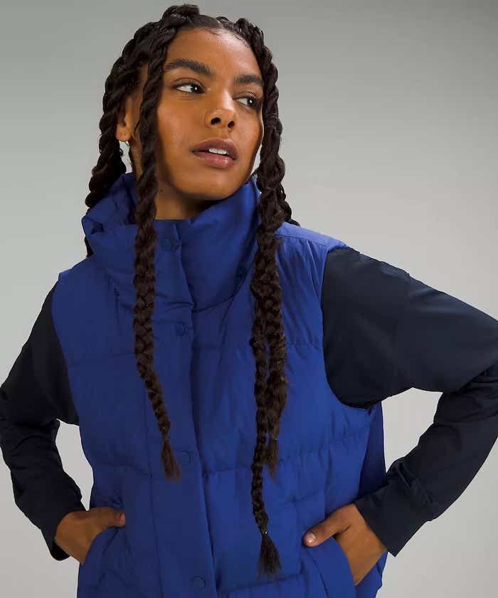 woman wearing blue puffer vest from lululemon