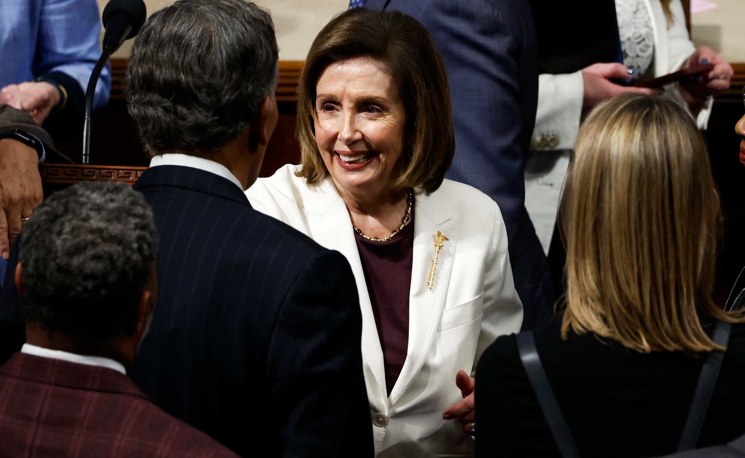 Nancy Pelosi shaking colleagues' hands