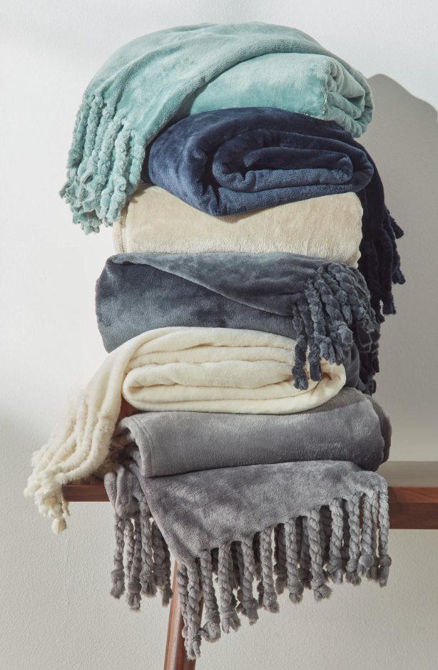 Stack of assorted color blankets