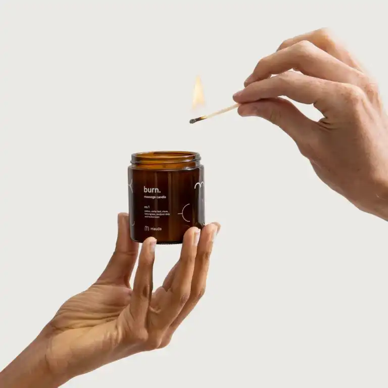 maude burn no. 1 hands lighting candle with matchstick