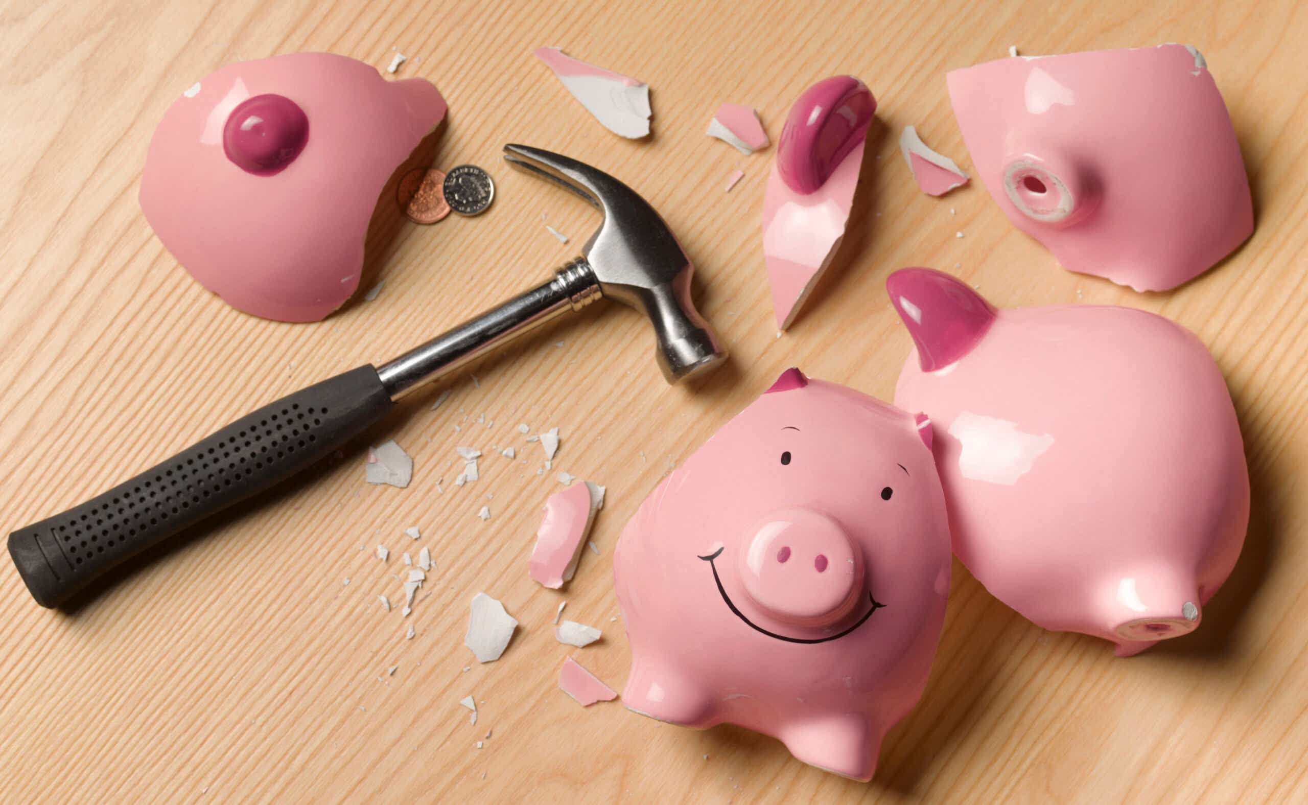 Smashed piggy bank and hammer