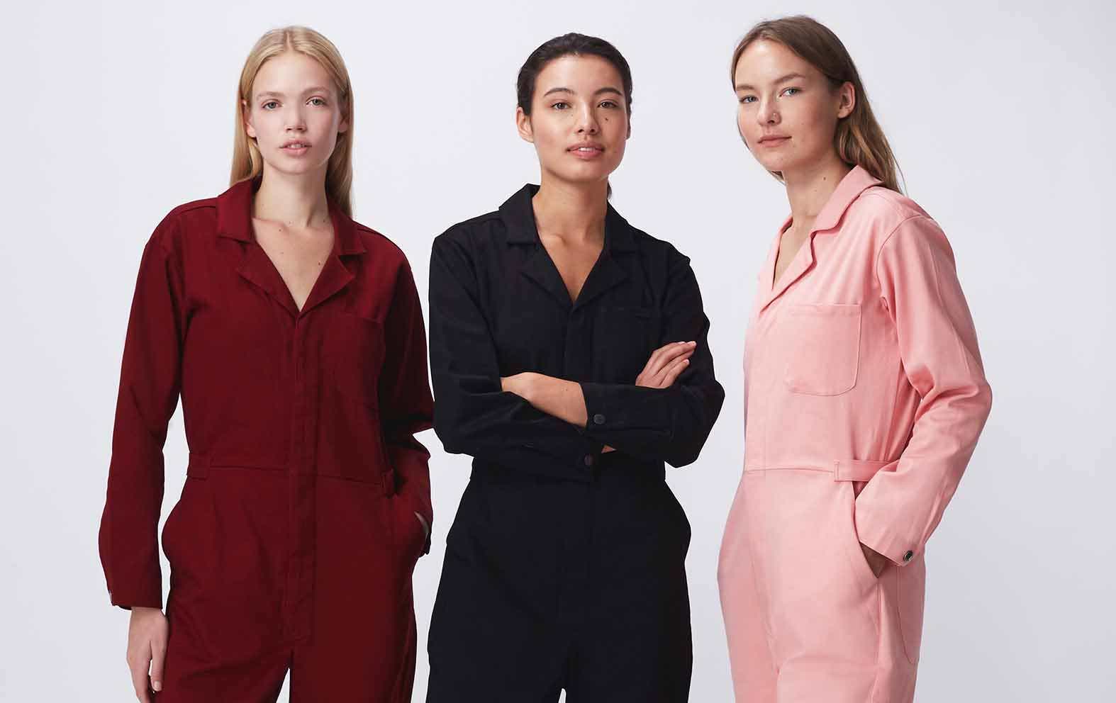Three women wearing For Days jumpsuits