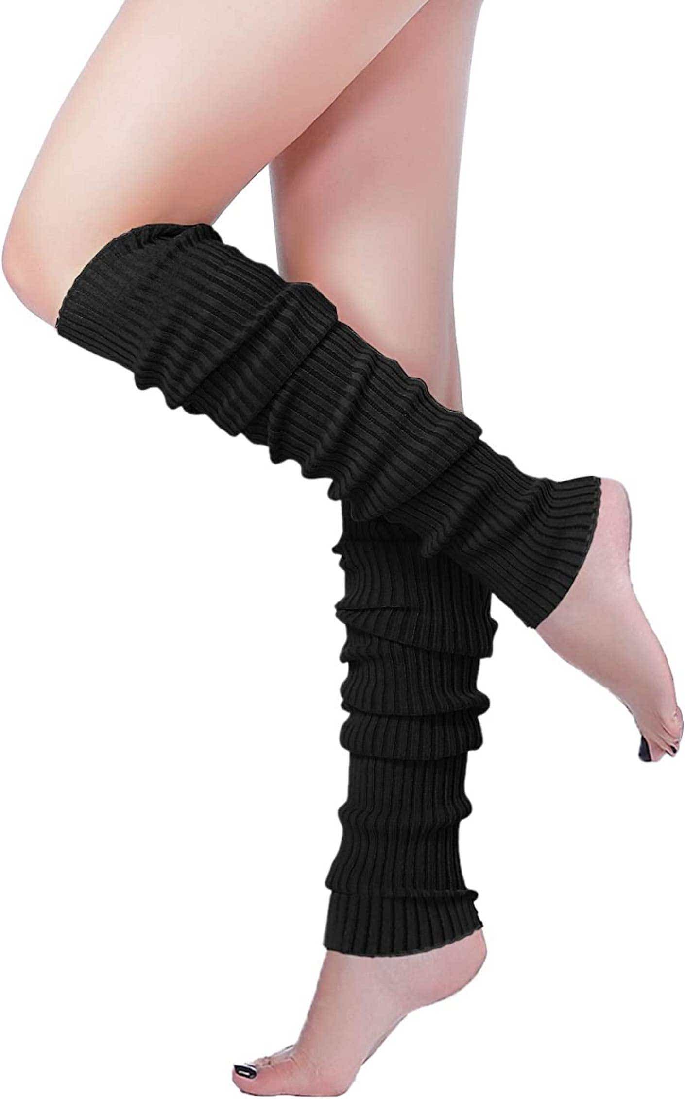 A person wears black leg warmers.