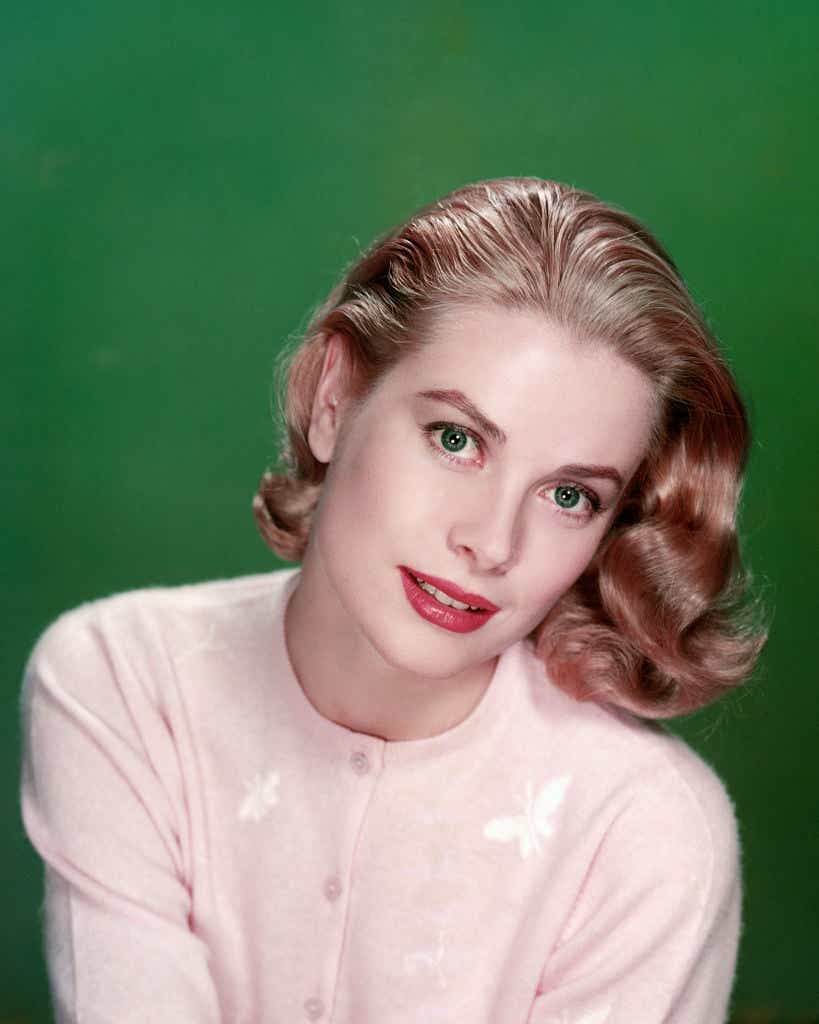 Grace Kelly headshot in pink butterfly sweater