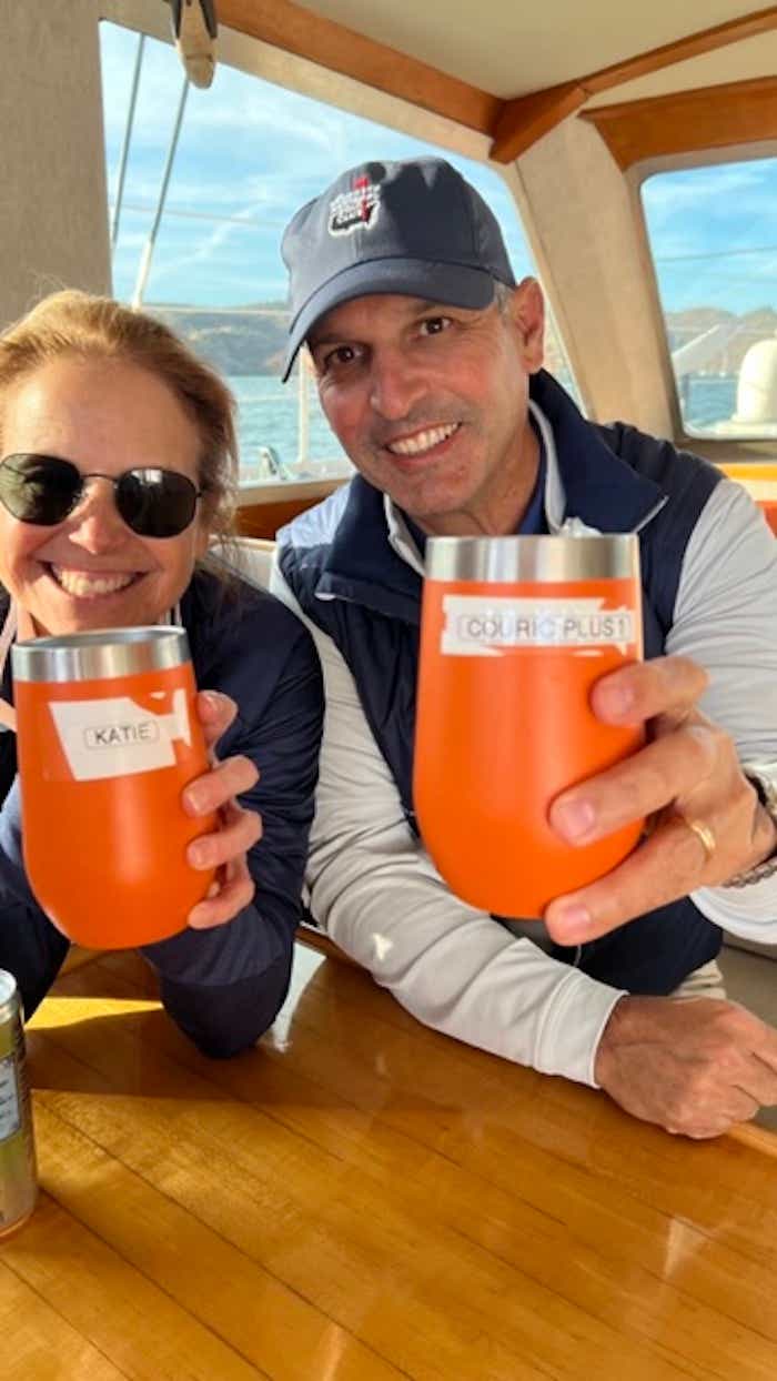 Katie and John aboard SeaLegacy (Katie's cup says her name on it, John's says "Couric Plus 1")