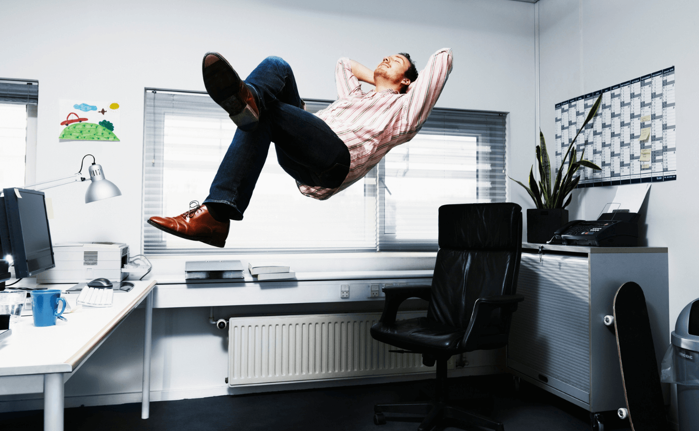 man floating in air in office
