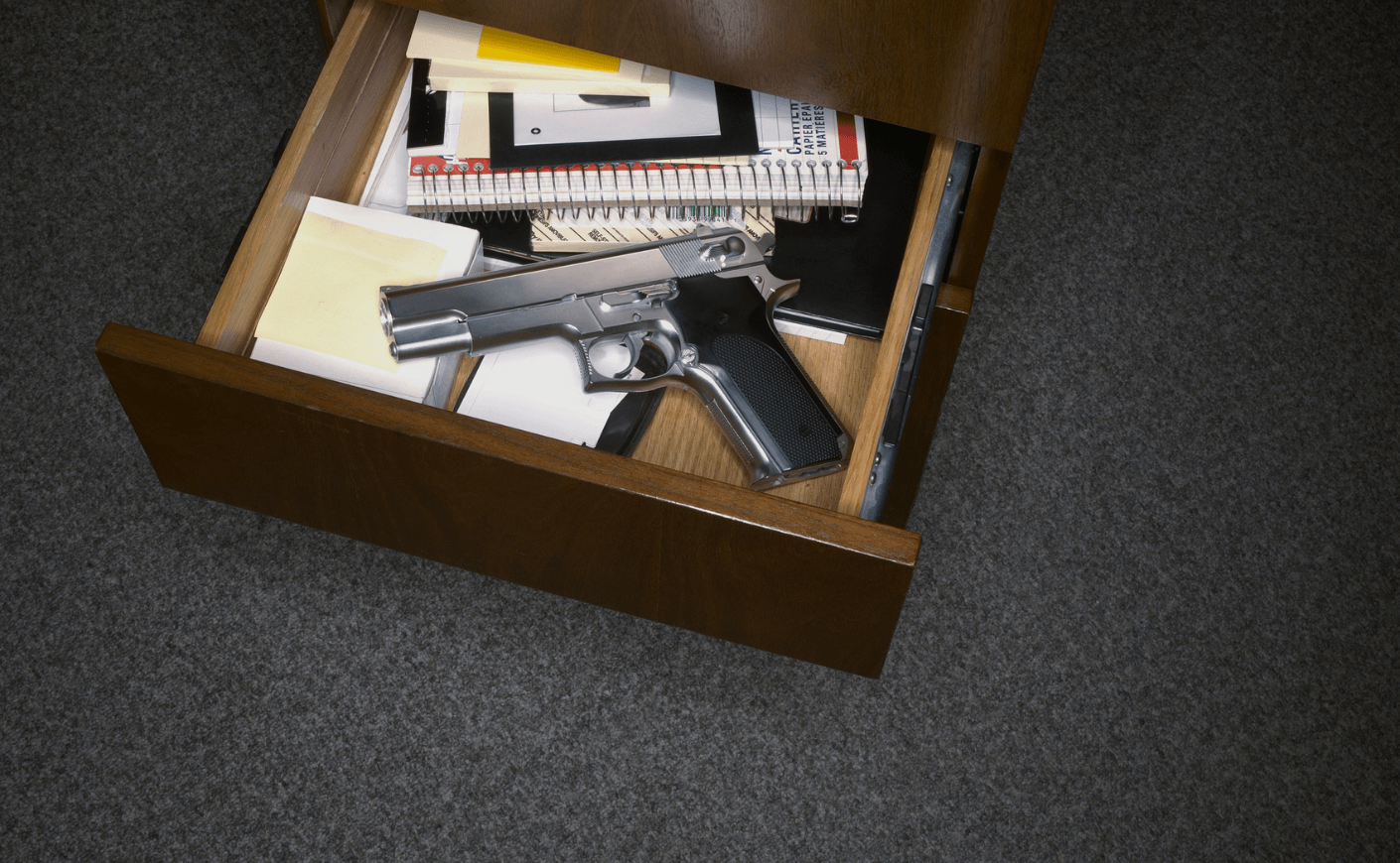 a gun in a drawer