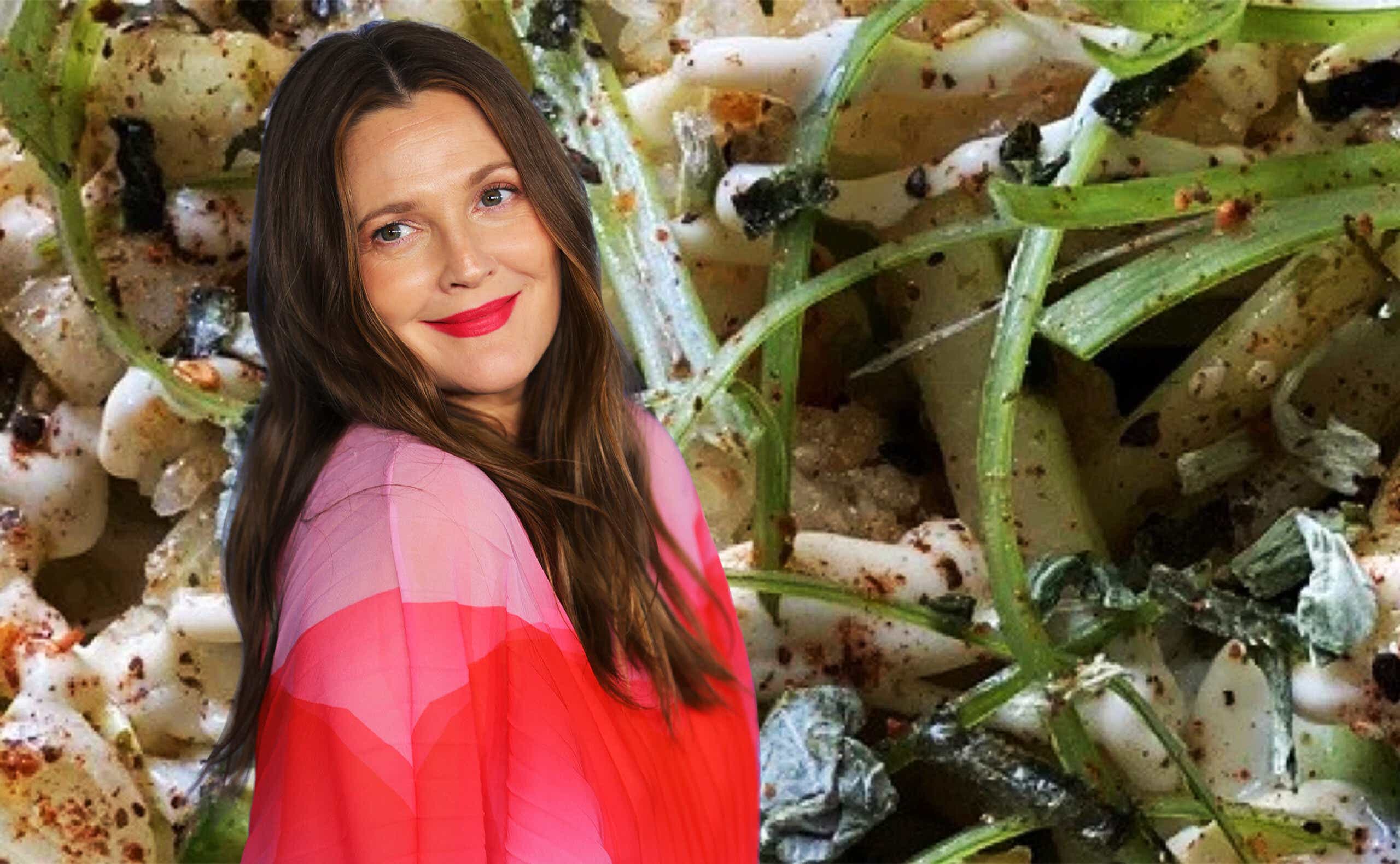 Drew Barrymore poses in front of an image of rice.