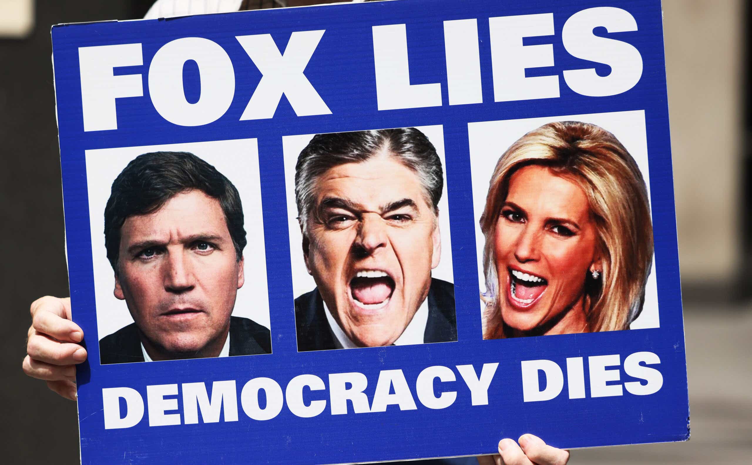 Protest sign reading "Fox lies democracy dies"