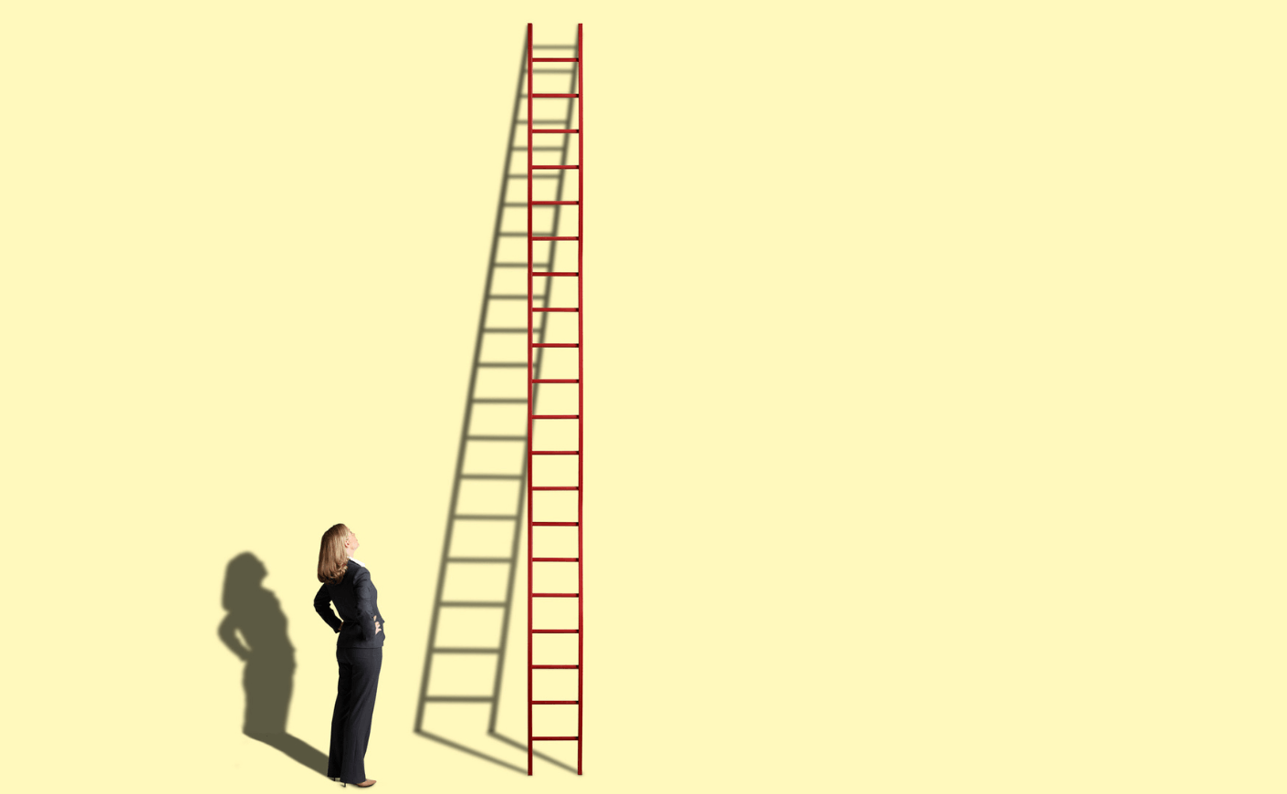 woman looking up at a ladder