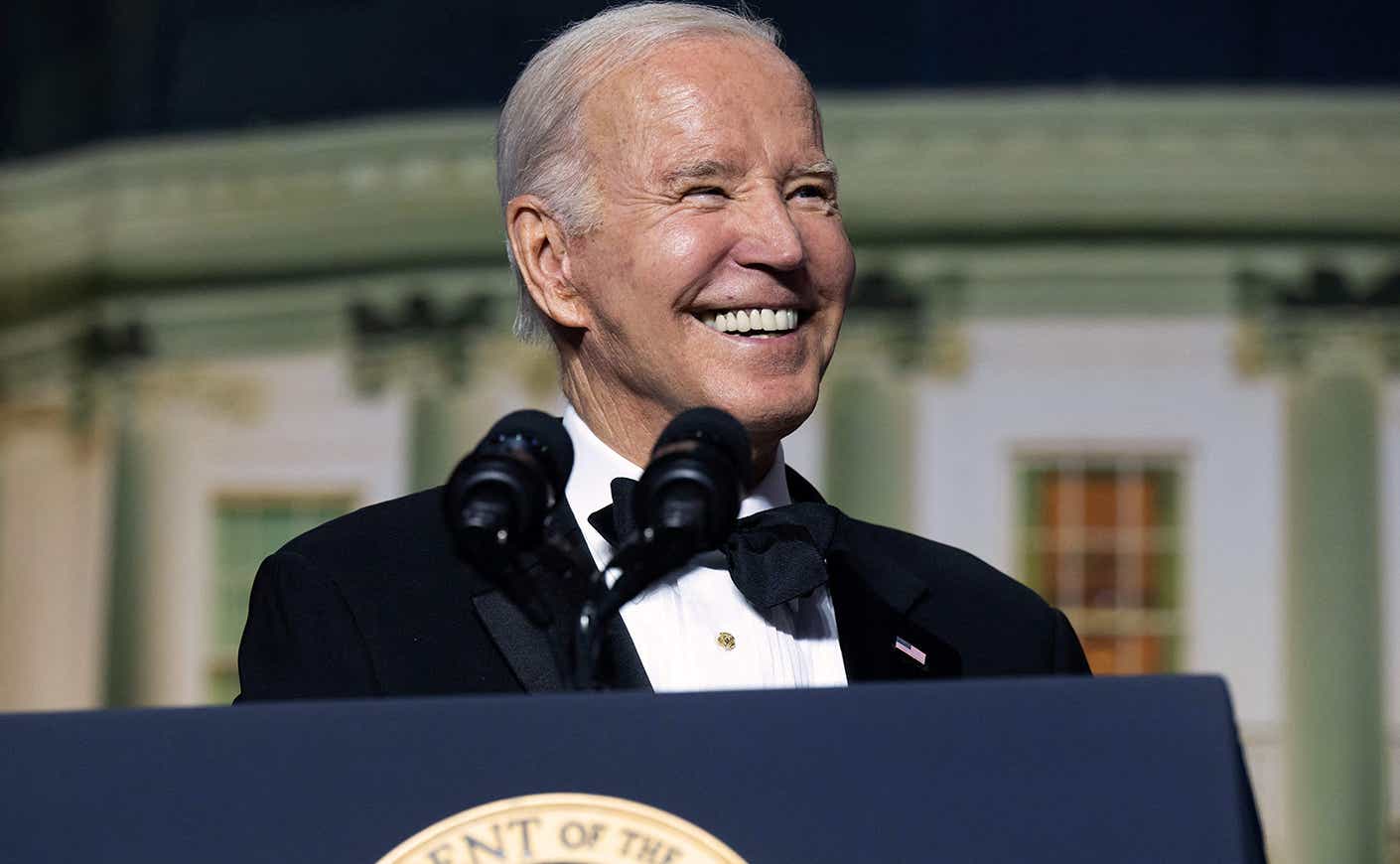 President Biden laughing during the White House Correspondents' Dinner 2023