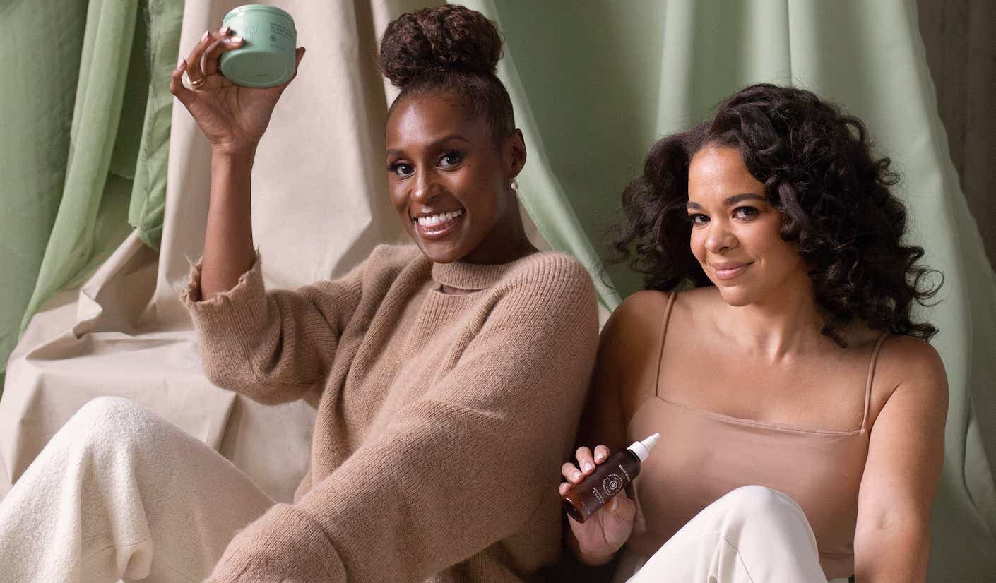 Issa Rae poses with hair cream