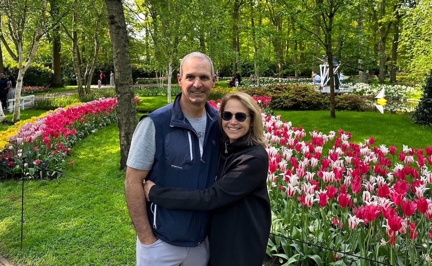 Katie and John in front of tulips in Amsterdam