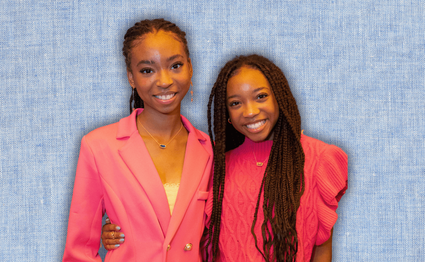 teen sisters on a blue background