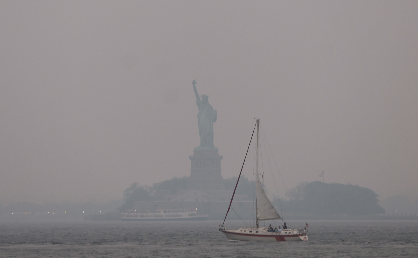 The Statue of Liberty in a haze of wildfire smoke