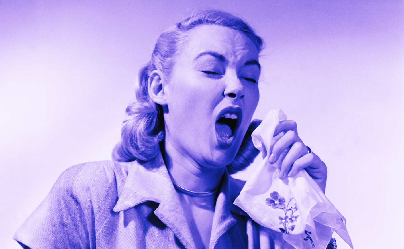 woman sneezing in the 1950s