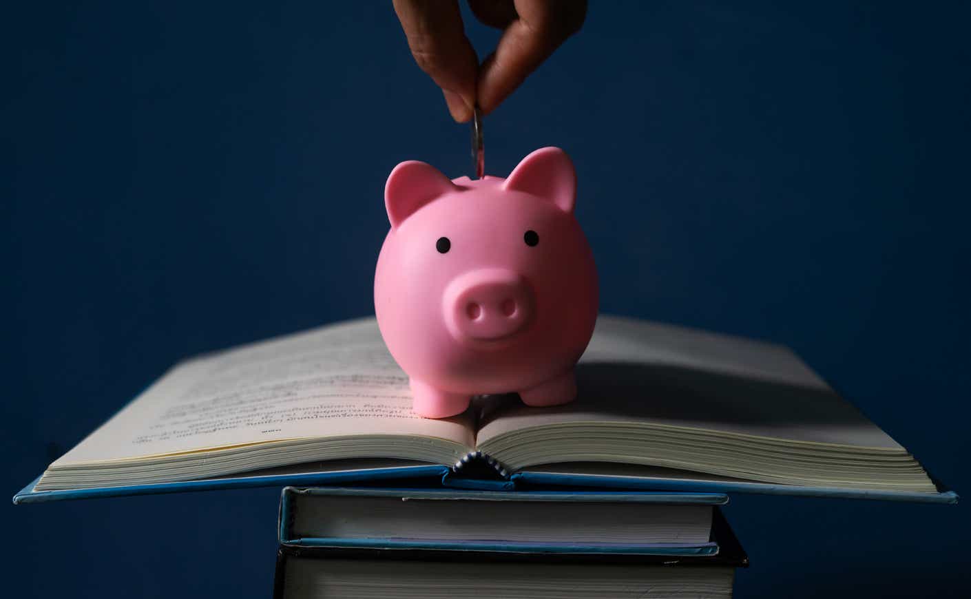 a piggy bank on top of a book