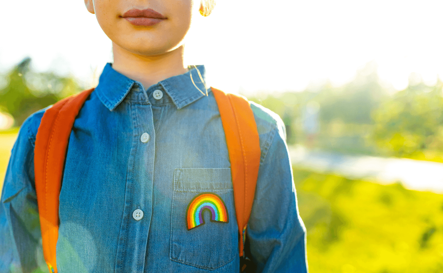 transgender child with rainbow patch