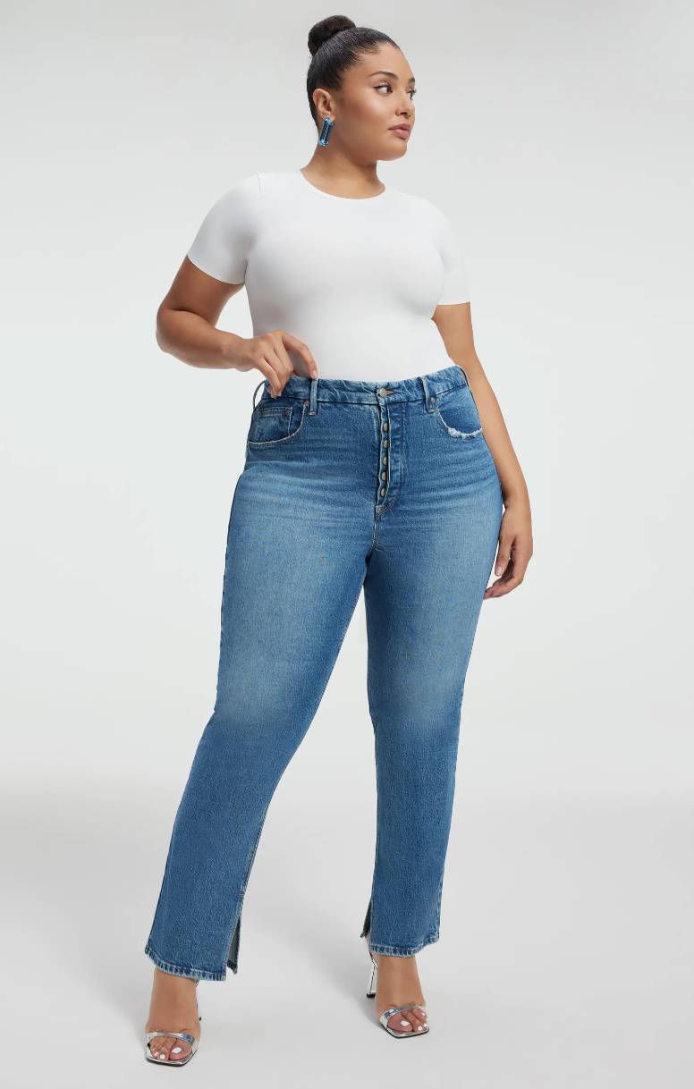 woman wearing good american high waisted jeans