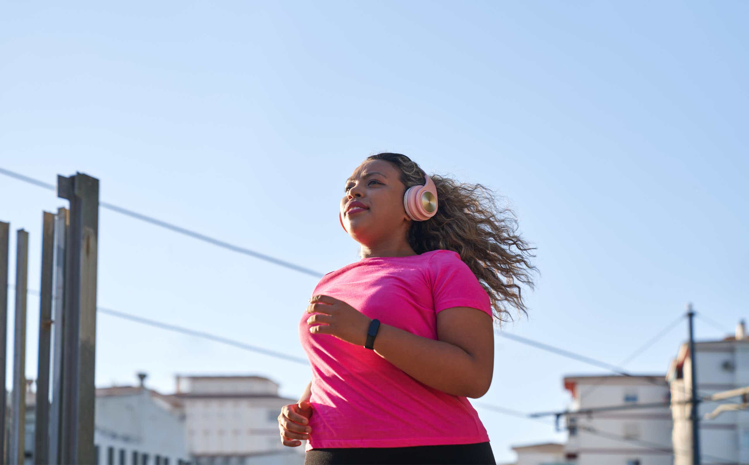 woman jogs in pink top