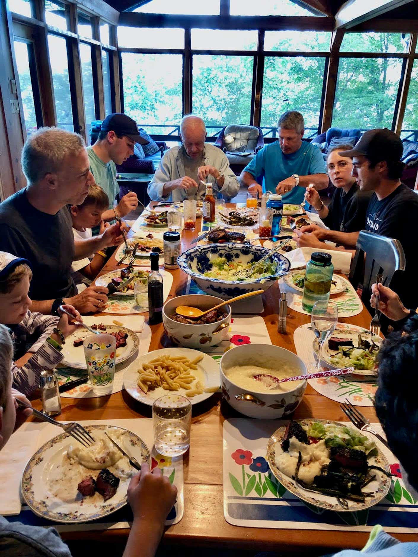 The Mondry family eats at a large table.