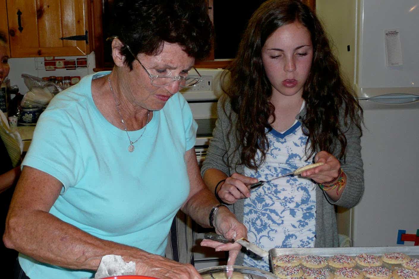 Mondry's mother and daughter make cookies.
